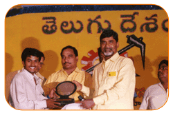 Mr. N Bitra Receiving A memento from Sri. N Chandra Babu Naidu, Ex. Chief Minister of Andhra Pradesh, India. Mr. N Bitra Receiving A memento from Sri. N Chandra Babu Naidu, Ex. Chief Minister of Andhra Pradesh, India.