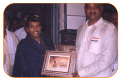 Mr. N Bitra Receiving A memento from Pinnamaneni Venkateswara Rao, Minister Technical Education, on the occasion of 56th Independence Day (15th August 2003). Bitra Net Pvt. Ltd., has donated two letest configuration computers to a School located in Puttagunta (Krishna Dist, Andhra Pradesh) Mr. N Bitra Receiving A memento from Pinnamaneni Venkateswara Rao, Minister Technical Education, on the occasion of 56th Independence Day (15th August 2003). Bitra Net Pvt. Ltd., has donated two letest configuration computers to a School located in Puttagunta (Krishna Dist, Andhra Pradesh)